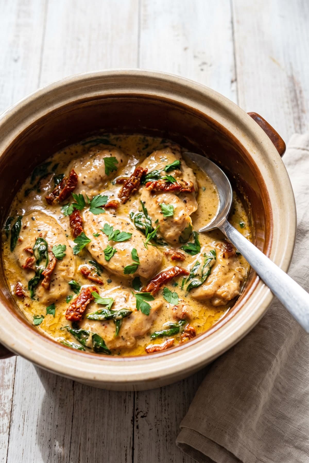 Creamy Tuscan Keto Crockpot Chicken ready to serve